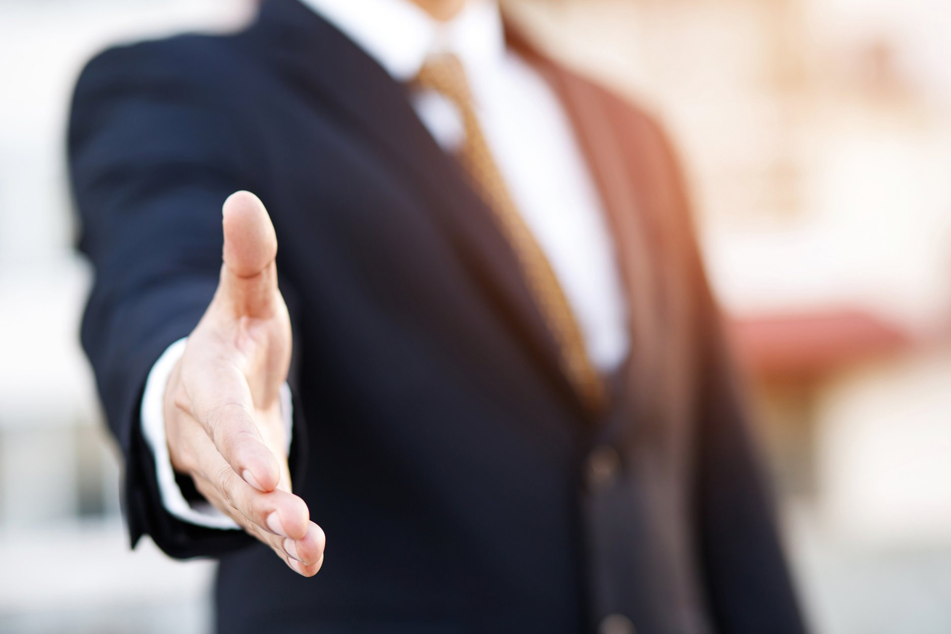 Businessman Extending His Hand for a Handshake